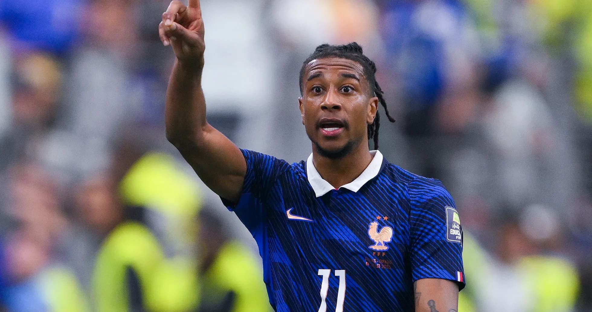 Player gesturing during a football match for France Player gesturing during a football match for France