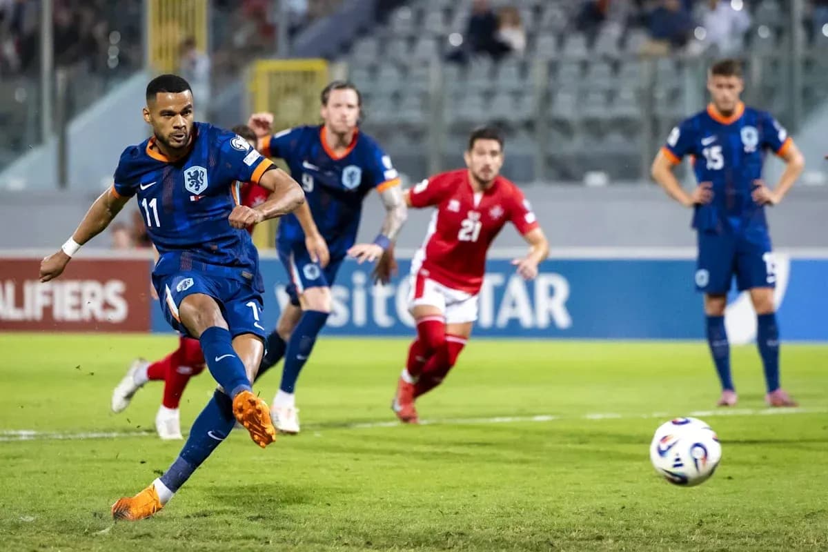 Player taking a penalty kick during a match Player taking a penalty kick during a match