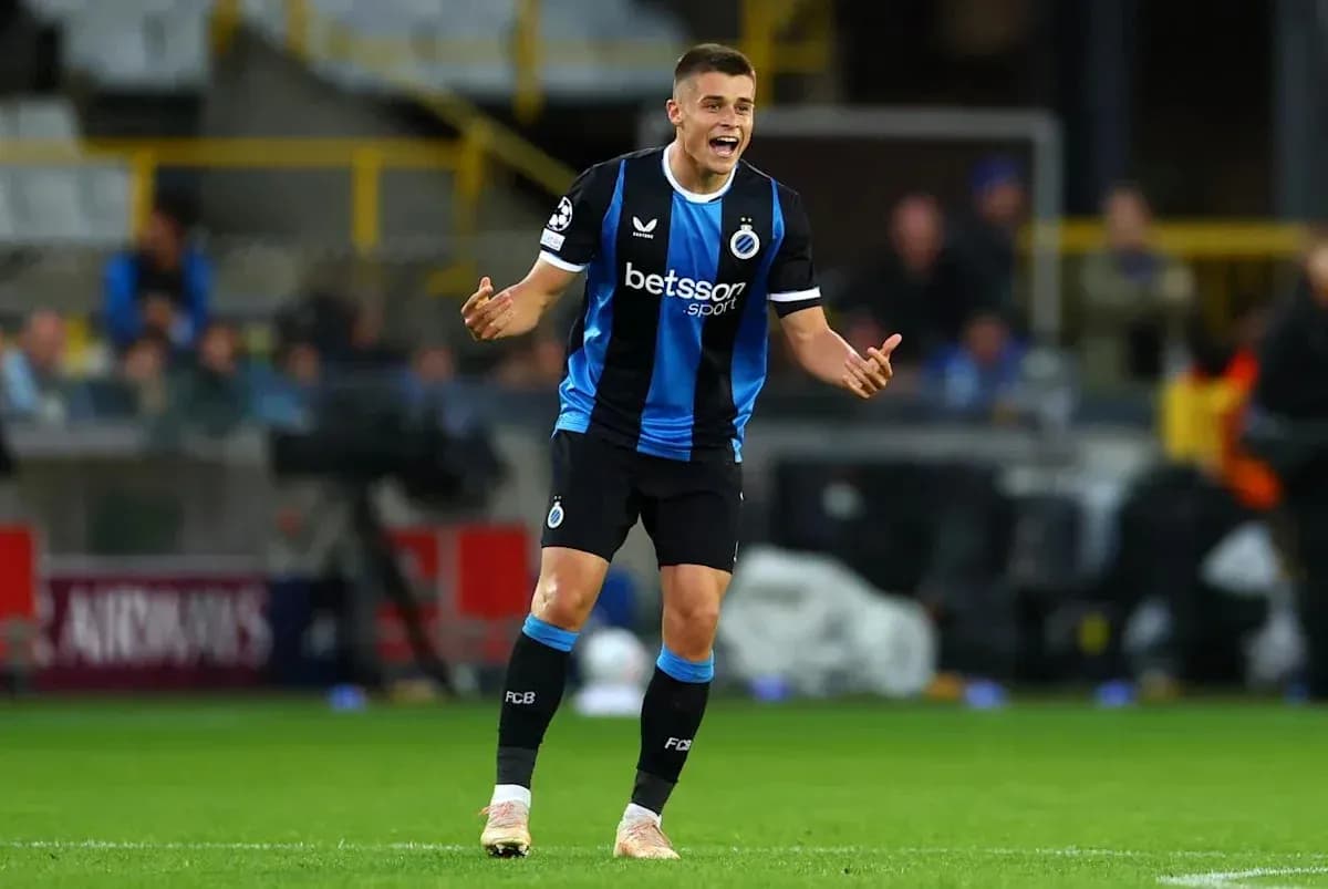 Player gesturing during match in blue and black kit Player gesturing during match in blue and black kit