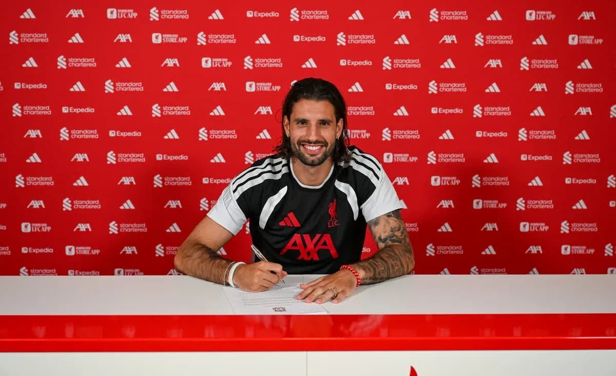 Player signing contract at press conference table Player signing contract at press conference table