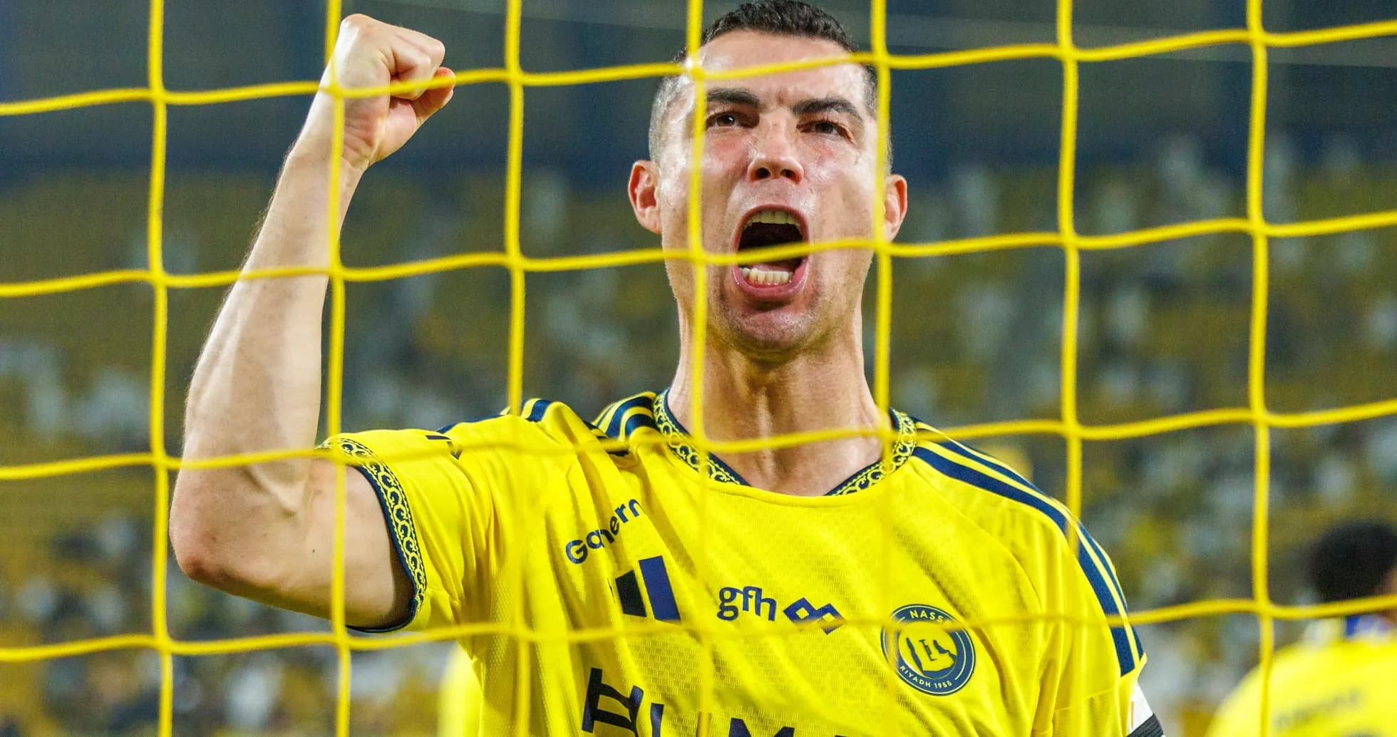 Player celebrating a goal behind the net Player celebrating a goal behind the net