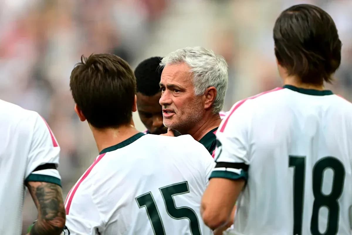 Manager discussing tactics with players during match Manager discussing tactics with players during match