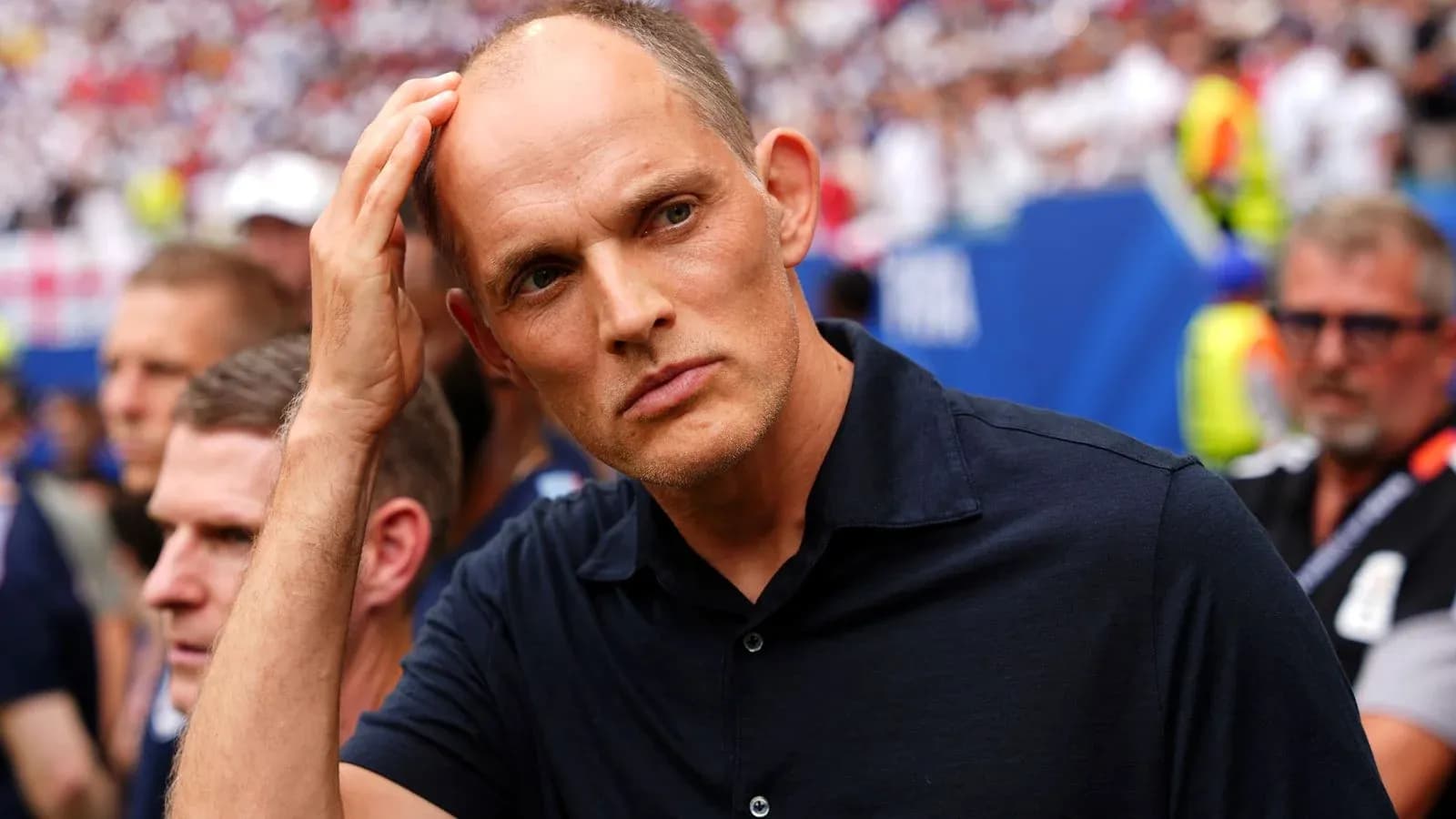 Coach observing match with focused expression Coach observing match with focused expression