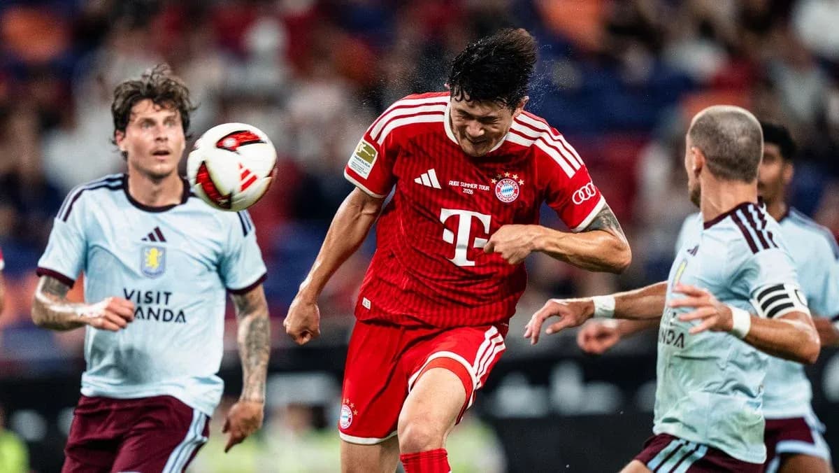 Player heading the ball during a soccer match Player heading the ball during a soccer match