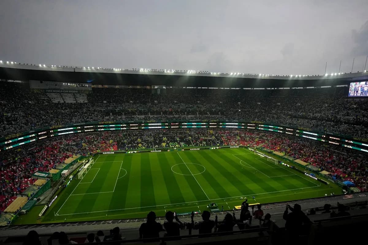 Full stadium with green soccer field before match Full stadium with green soccer field before match