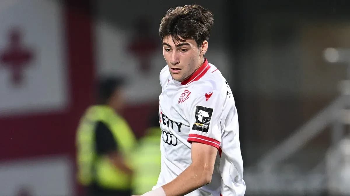 Player in white jersey during soccer match action Player in white jersey during soccer match action