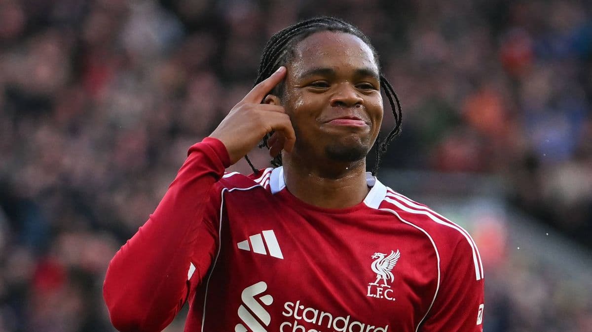 Player celebrating a goal with a hand gesture Player celebrating a goal with a hand gesture