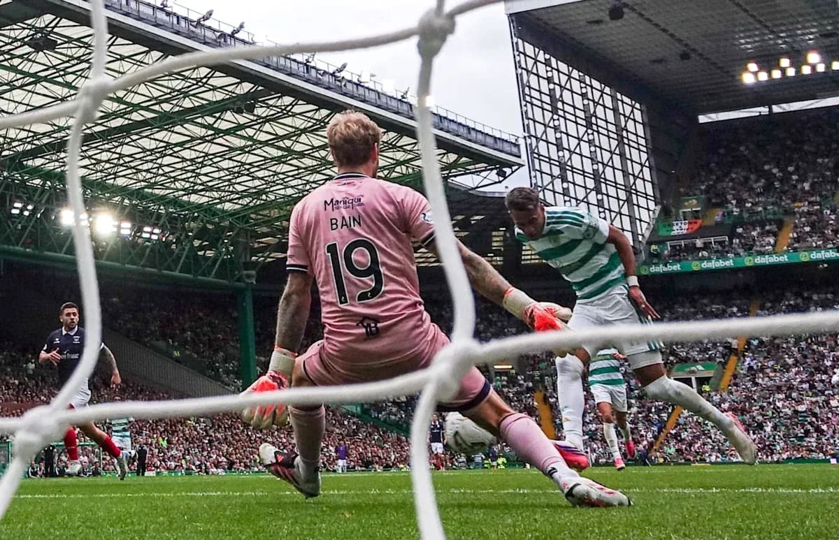 Goalkeeper attempting to save shot during match Goalkeeper attempting to save shot during match