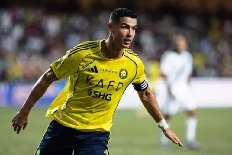 Player in yellow jersey celebrating during match Player in yellow jersey celebrating during match