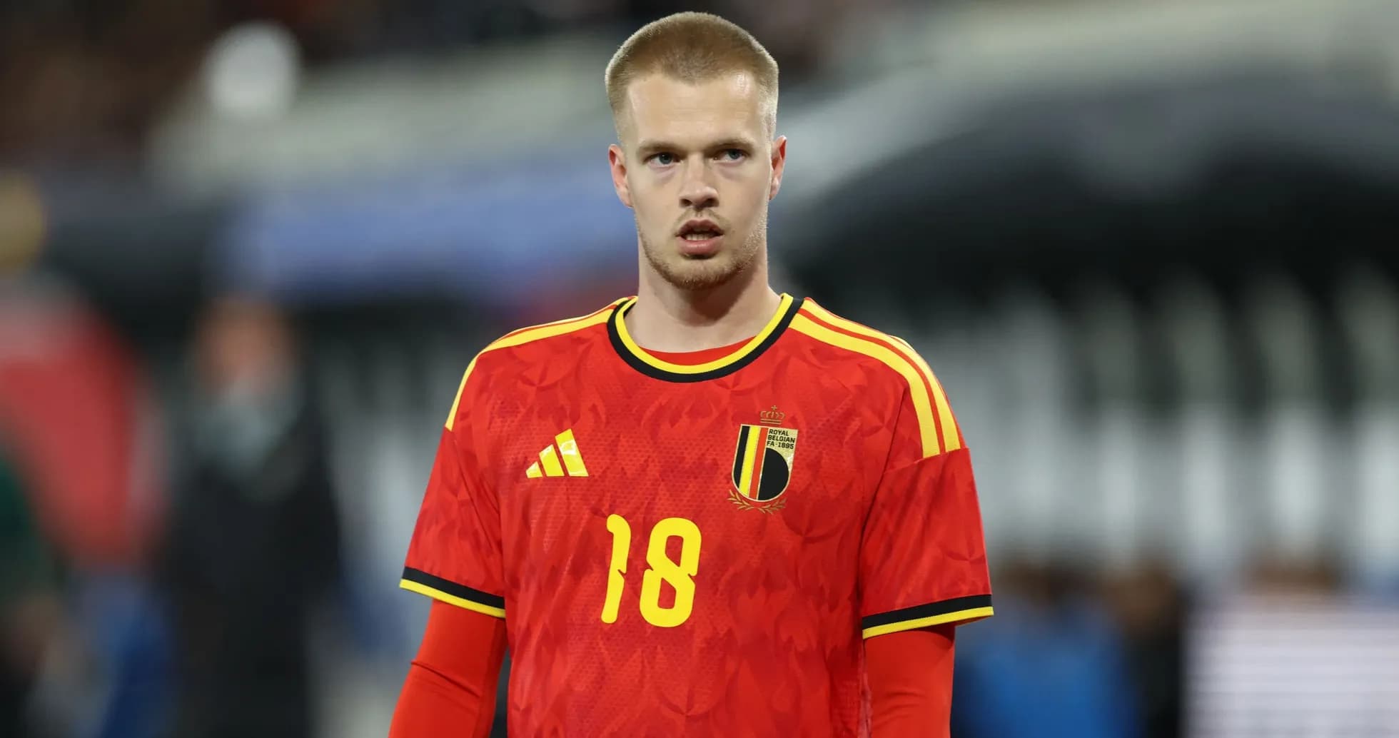 Player wearing Belgium national team jersey on field Player wearing Belgium national team jersey on field