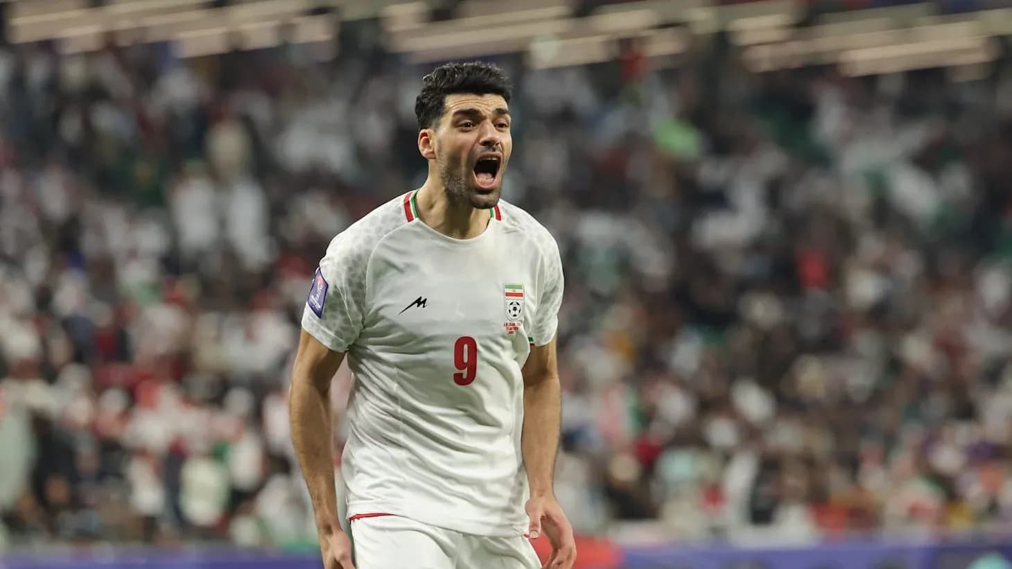 Iran player celebrating during World Cup match Iran player celebrating during World Cup match