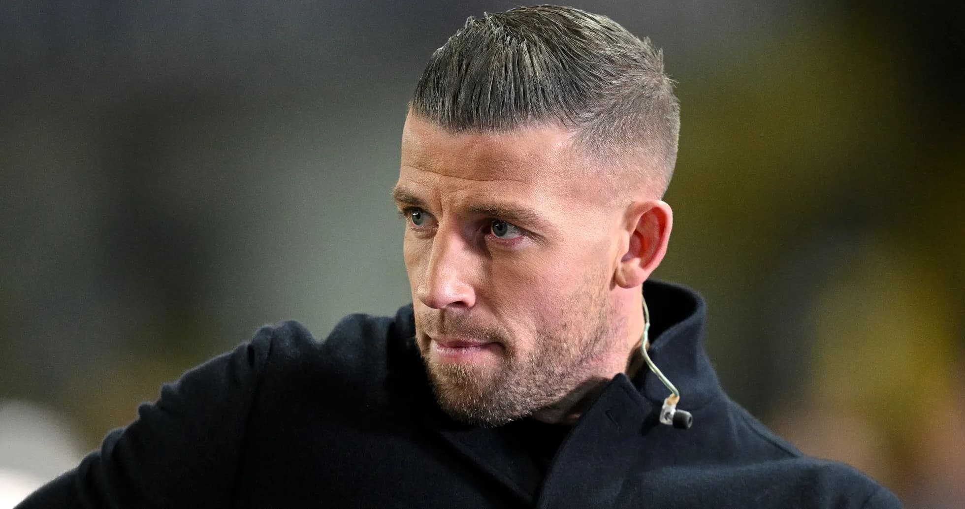 Man with short hair wearing a dark coat Man with short hair wearing a dark coat