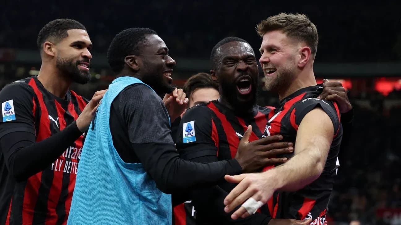 AC Milan players celebrating a goal AC Milan players celebrating a goal