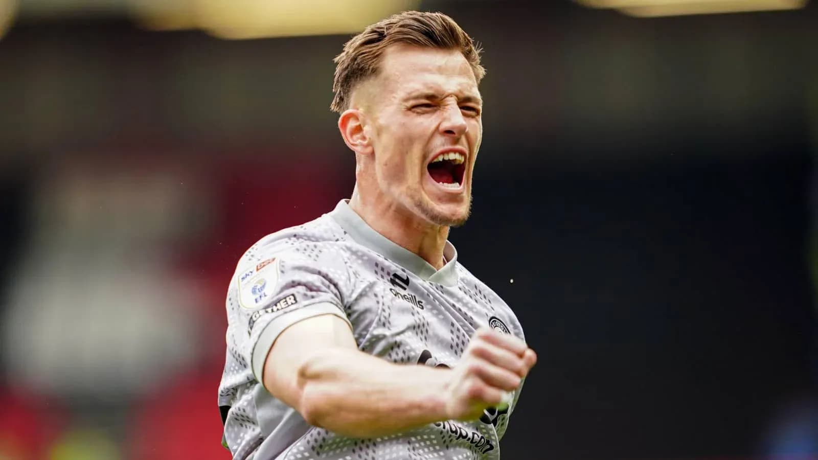 Player celebrating enthusiastically during a match Player celebrating enthusiastically during a match