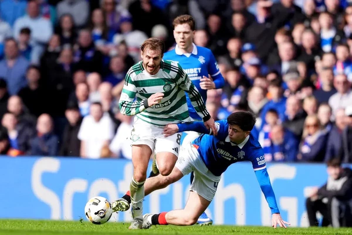 Celtic player evading a tackle from Rangers opponent Celtic player evading a tackle from Rangers opponent