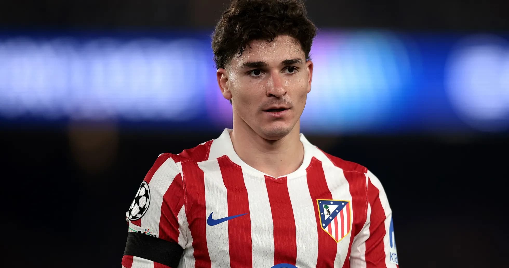 Atletico Madrid player in home jersey during match Atletico Madrid player in home jersey during match