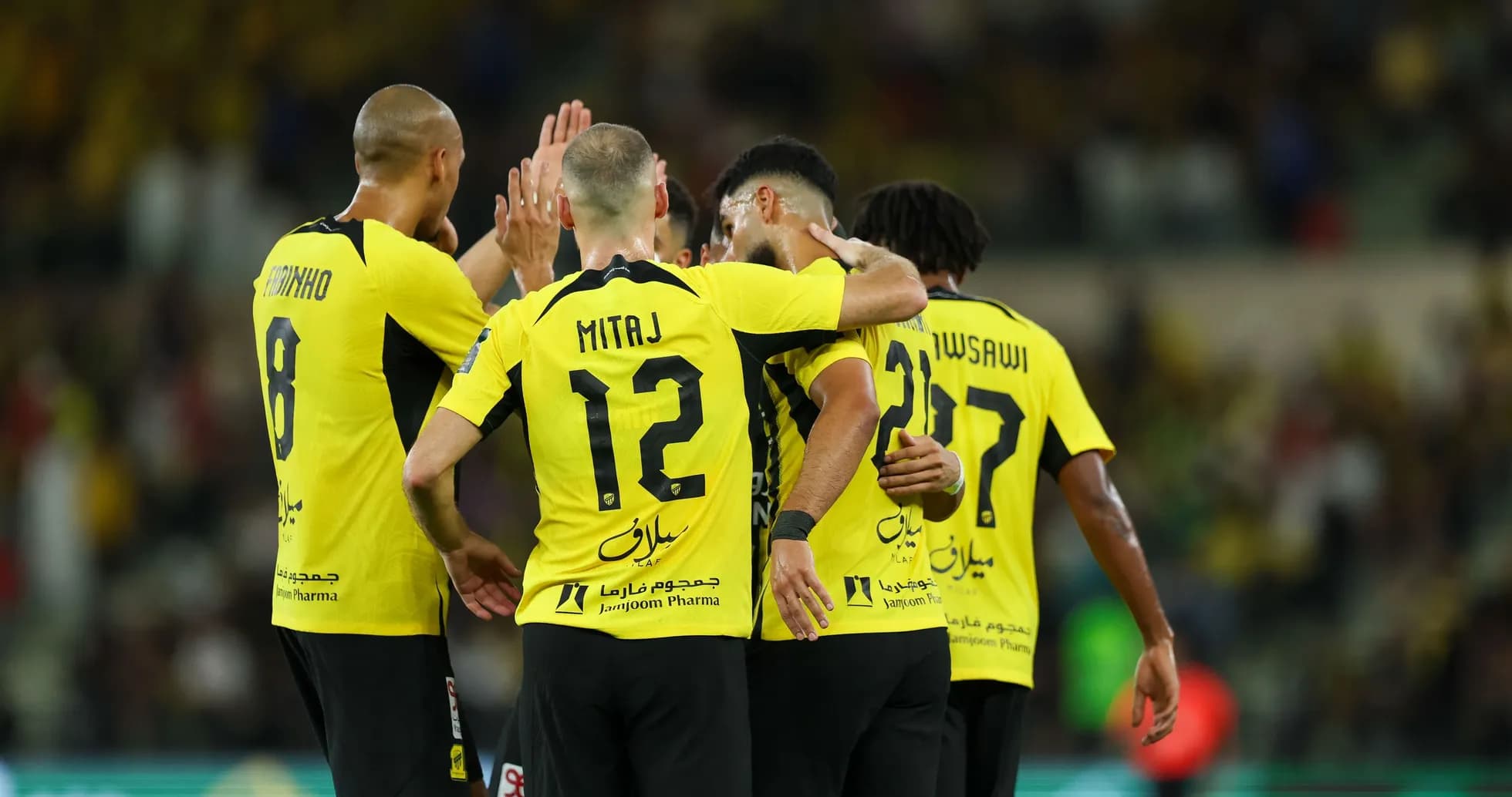 Players celebrating together after scoring a goal Players celebrating together after scoring a goal