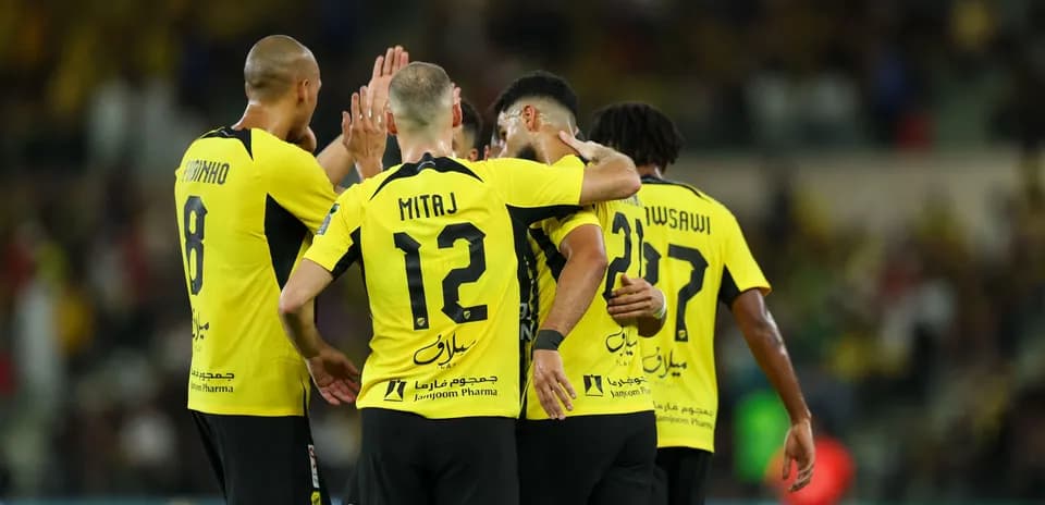 Players celebrating together after scoring a goal Players celebrating together after scoring a goal