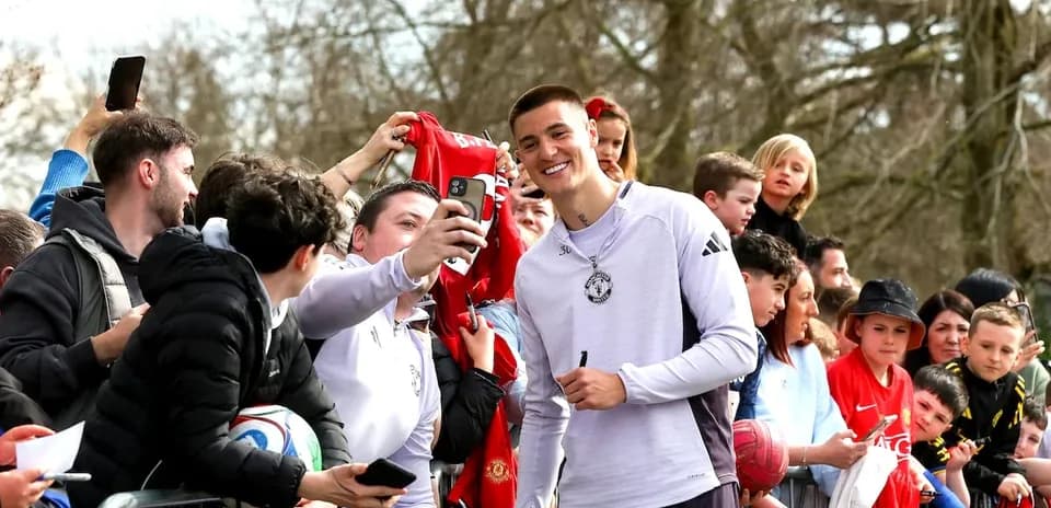 Goalkeeper taking selfie with fans at event Goalkeeper taking selfie with fans at event