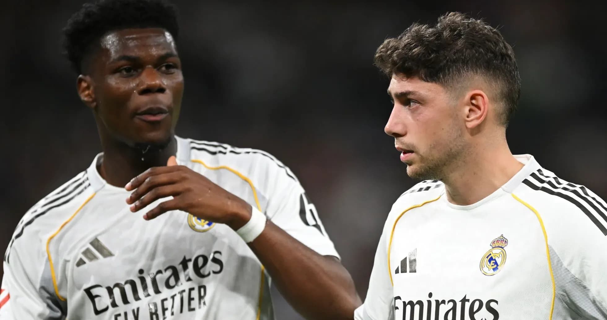 Two Real Madrid players discussing on the field Two Real Madrid players discussing on the field