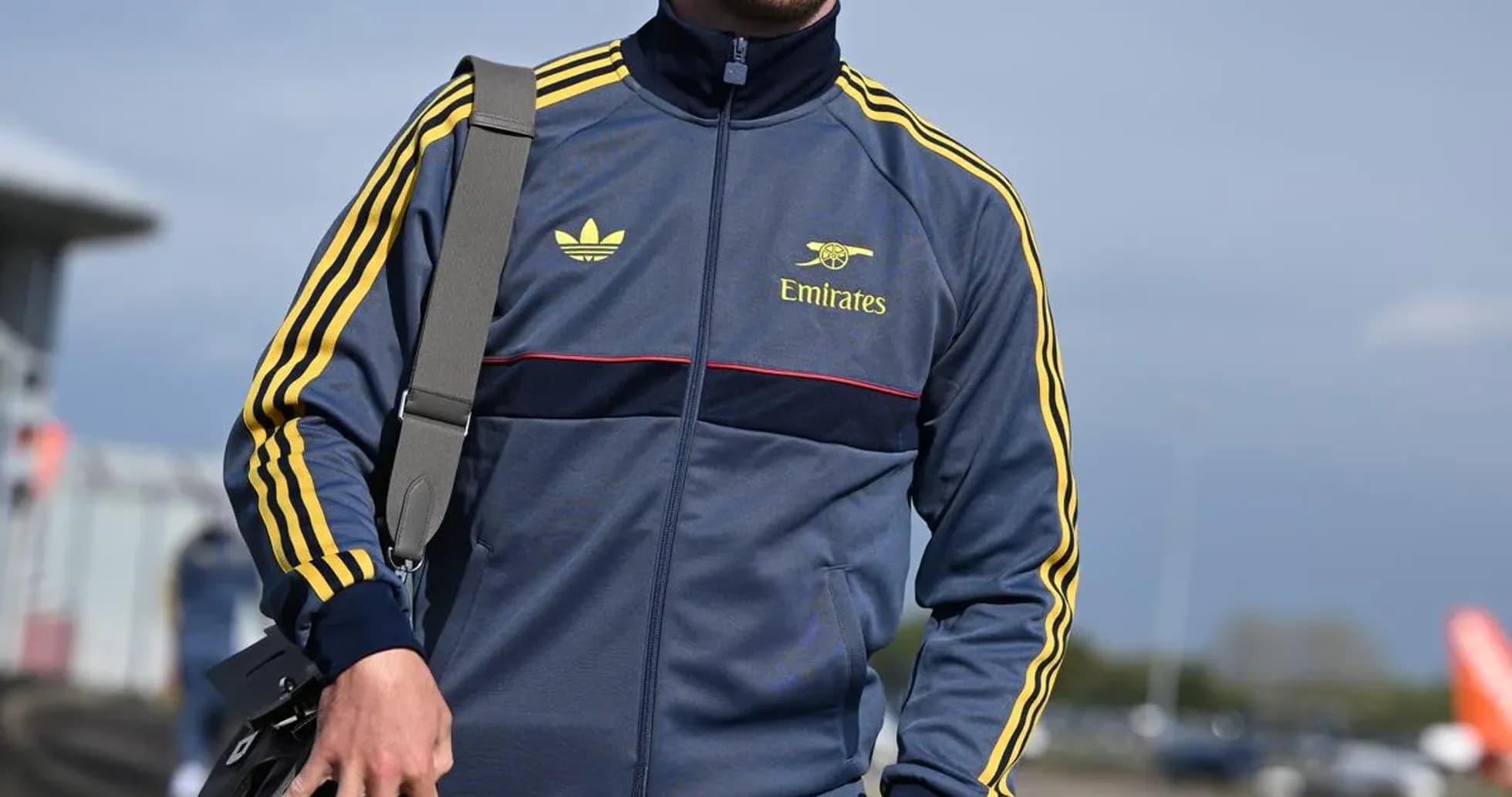 Athlete wearing tracksuit and cap at airport Athlete wearing tracksuit and cap at airport