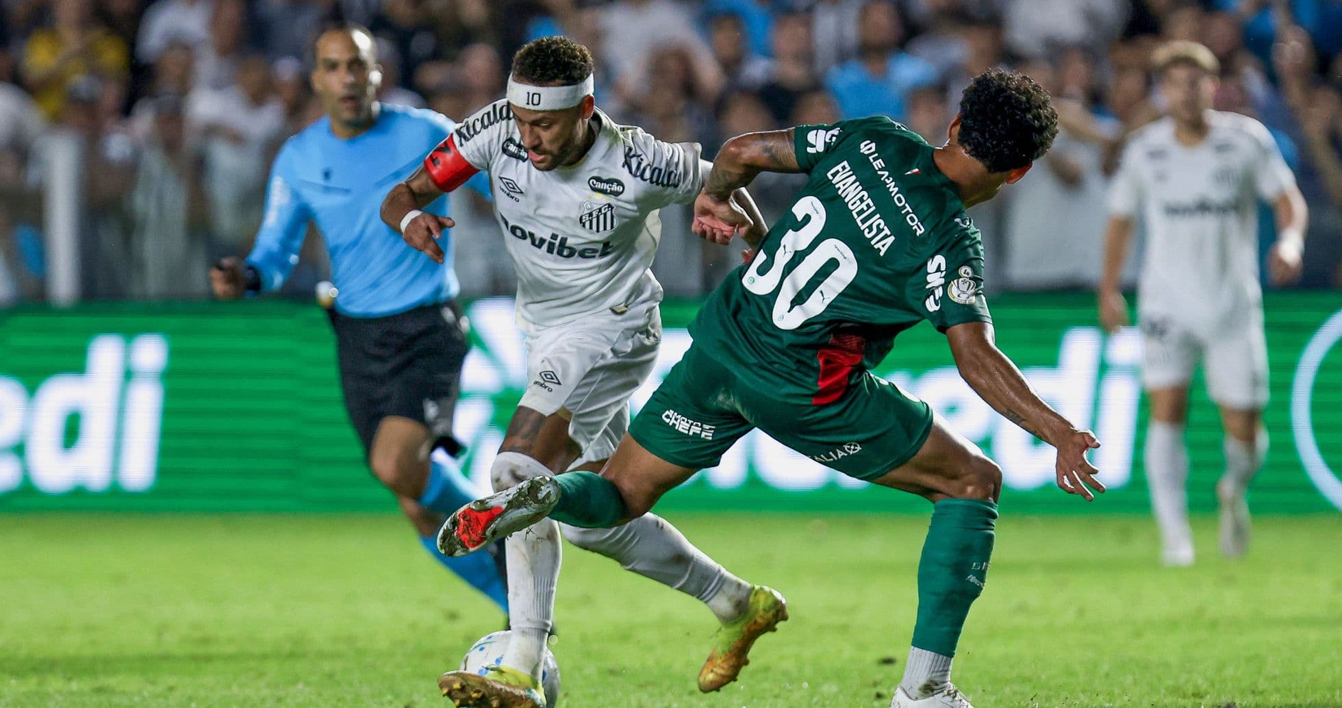 Player dribbling past opponent during a match Player dribbling past opponent during a match