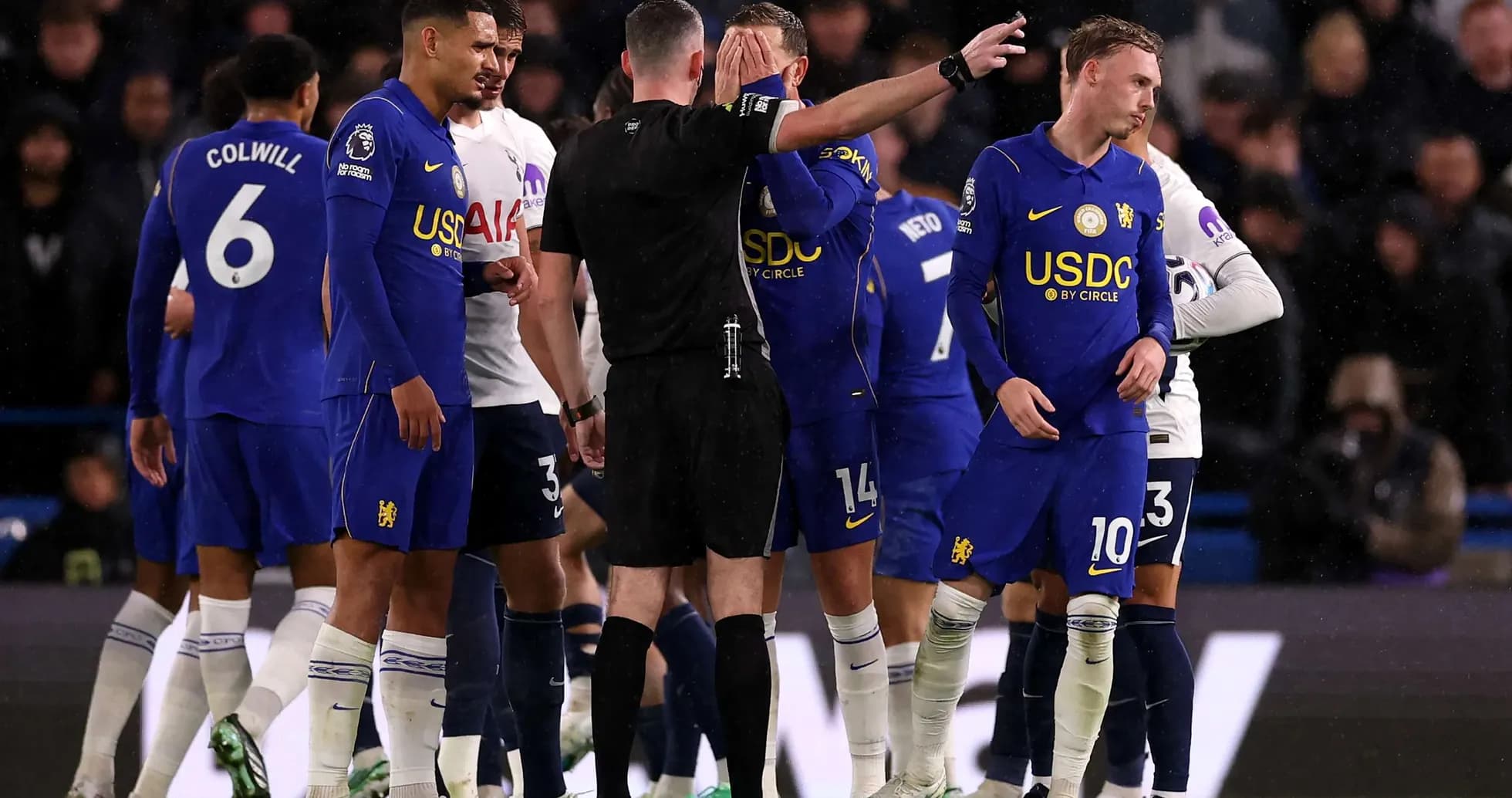 Chelsea players interacting with referee during match Chelsea players interacting with referee during match