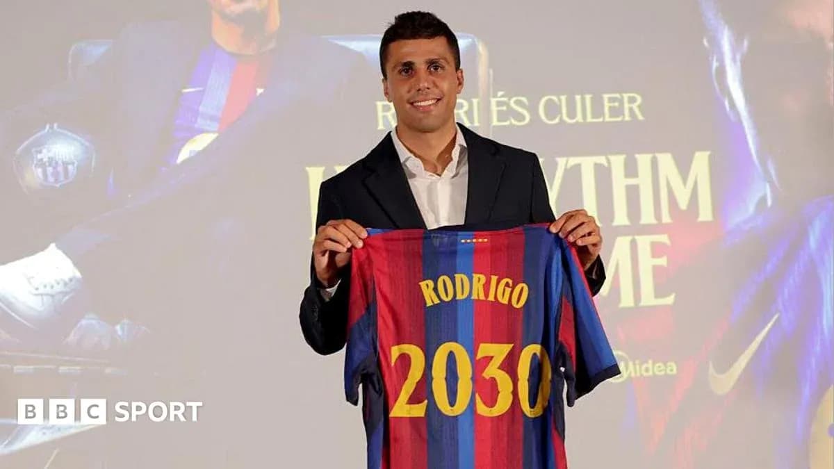 Player holding Barcelona jersey at presentation event Player holding Barcelona jersey at presentation event