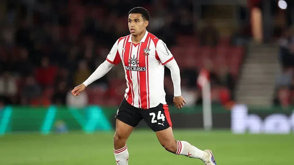 Player in Southampton kit running on the field Player in Southampton kit running on the field