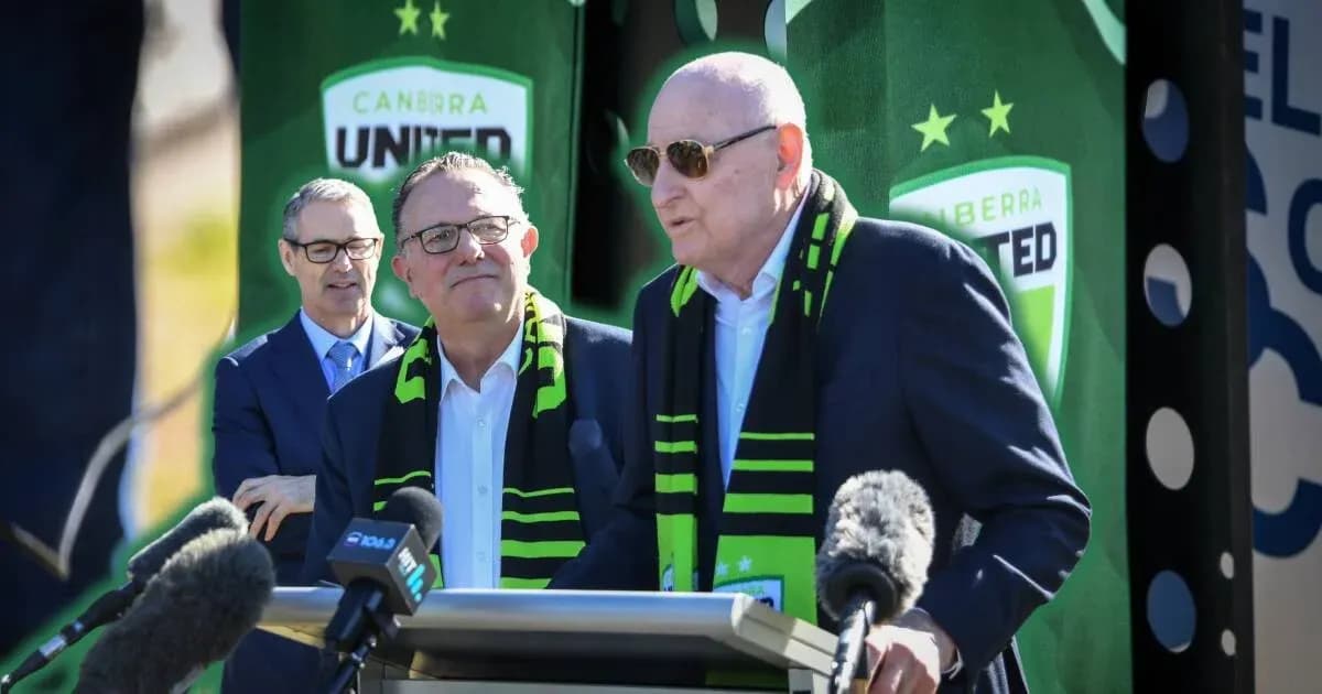 Officials speaking at Canberra United event with scarves Officials speaking at Canberra United event with scarves
