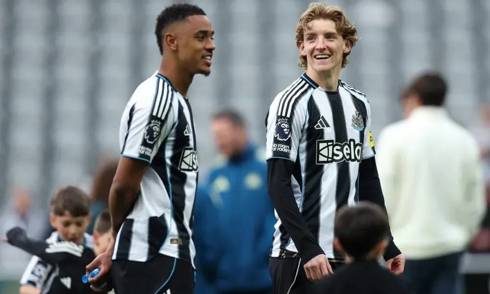 Two Newcastle players interacting during warm-up session Two Newcastle players interacting during warm-up session