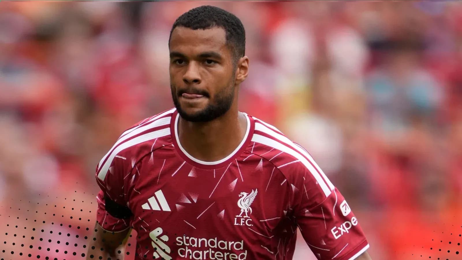 Player in Liverpool kit walking on the pitch Player in Liverpool kit walking on the pitch