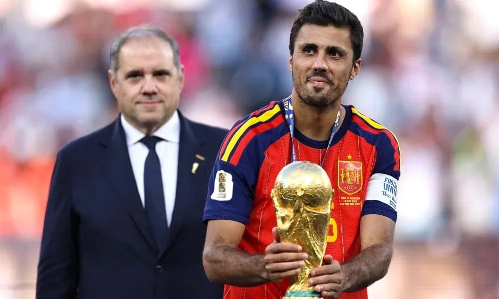 Player holding World Cup trophy on podium Player holding World Cup trophy on podium