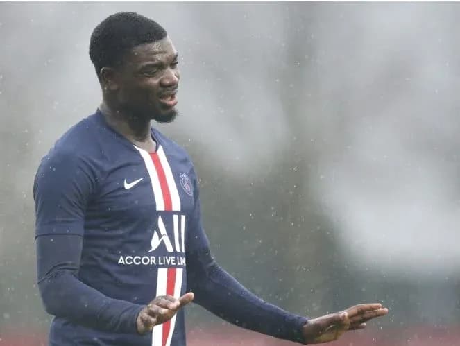 Player gesturing during training in rainy weather Player gesturing during training in rainy weather