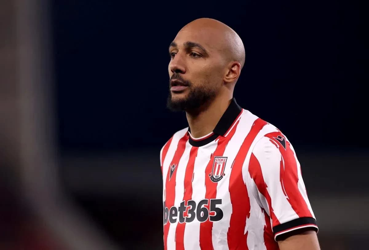 Player in red and white striped jersey during match Player in red and white striped jersey during match