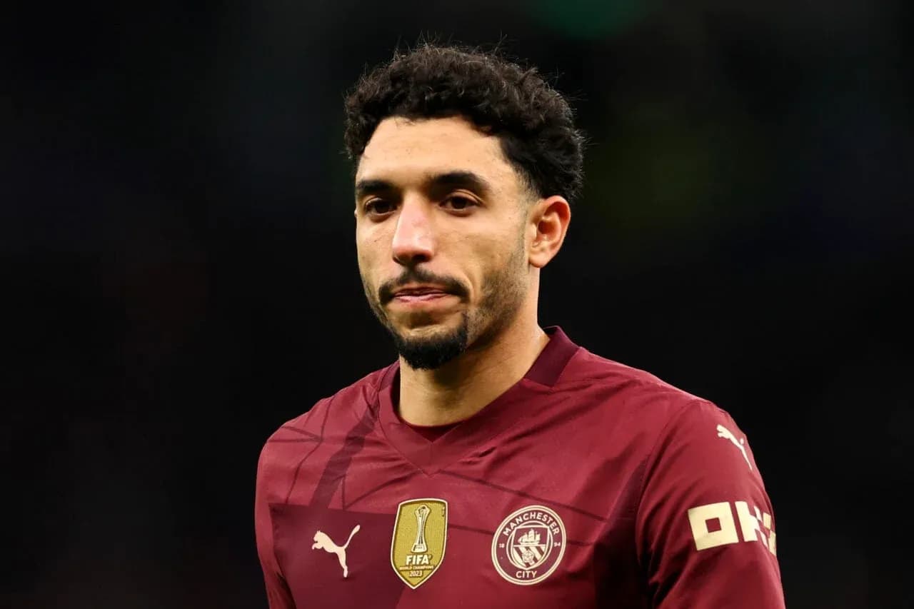 Player in maroon Manchester City jersey during match Player in maroon Manchester City jersey during match