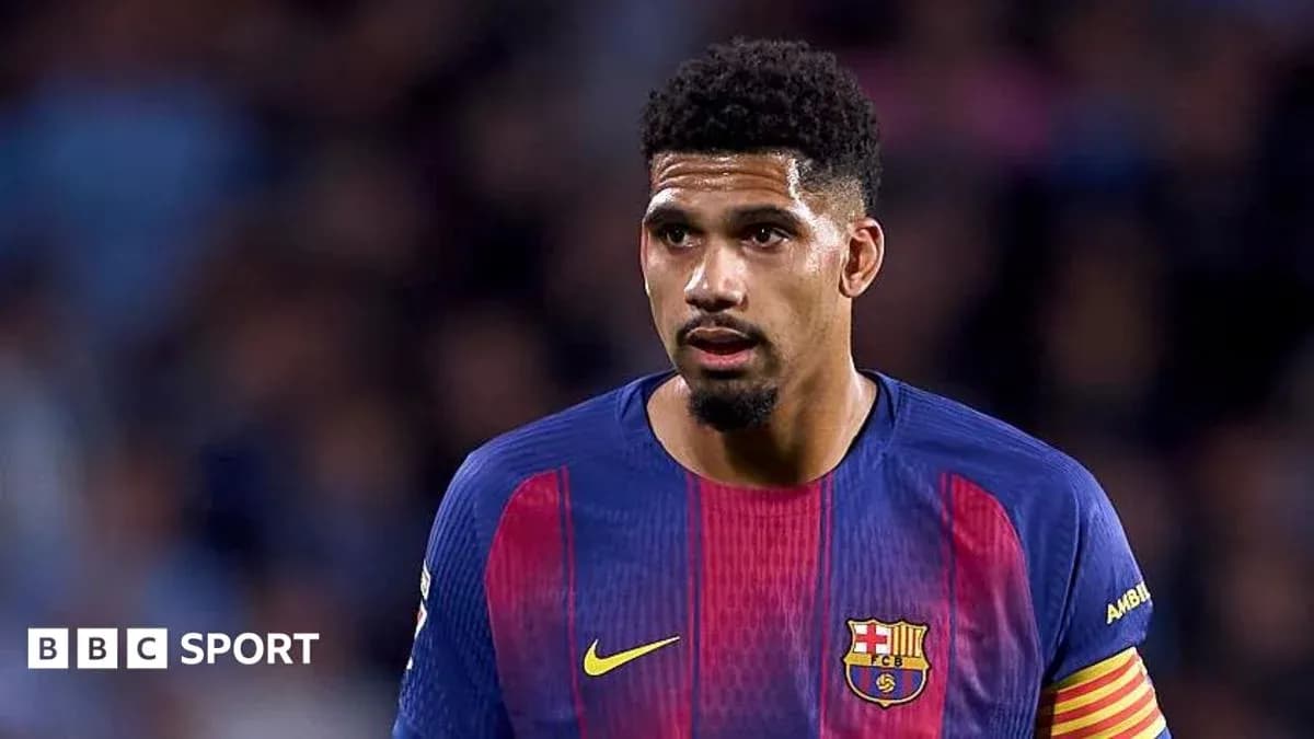 Barcelona player in match jersey on field Barcelona player in match jersey on field