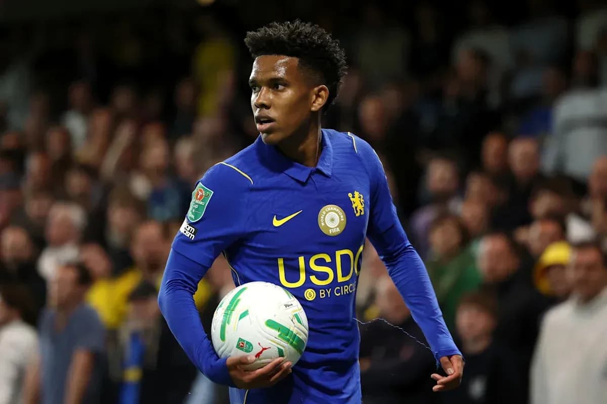 Player in blue kit holding a football during match Player in blue kit holding a football during match