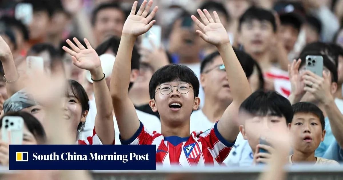 Fans cheering in stands during a sporting event Fans cheering in stands during a sporting event