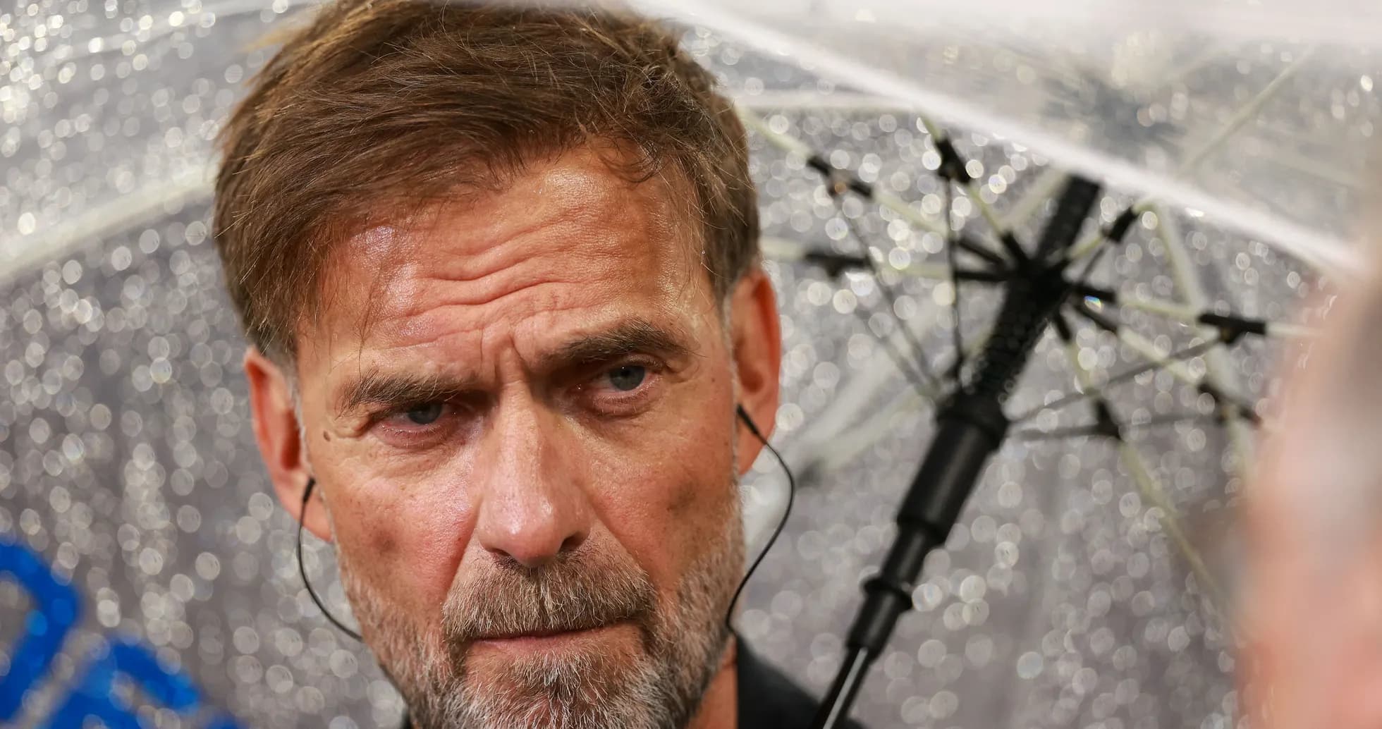 Manager speaking under an umbrella during rain Manager speaking under an umbrella during rain