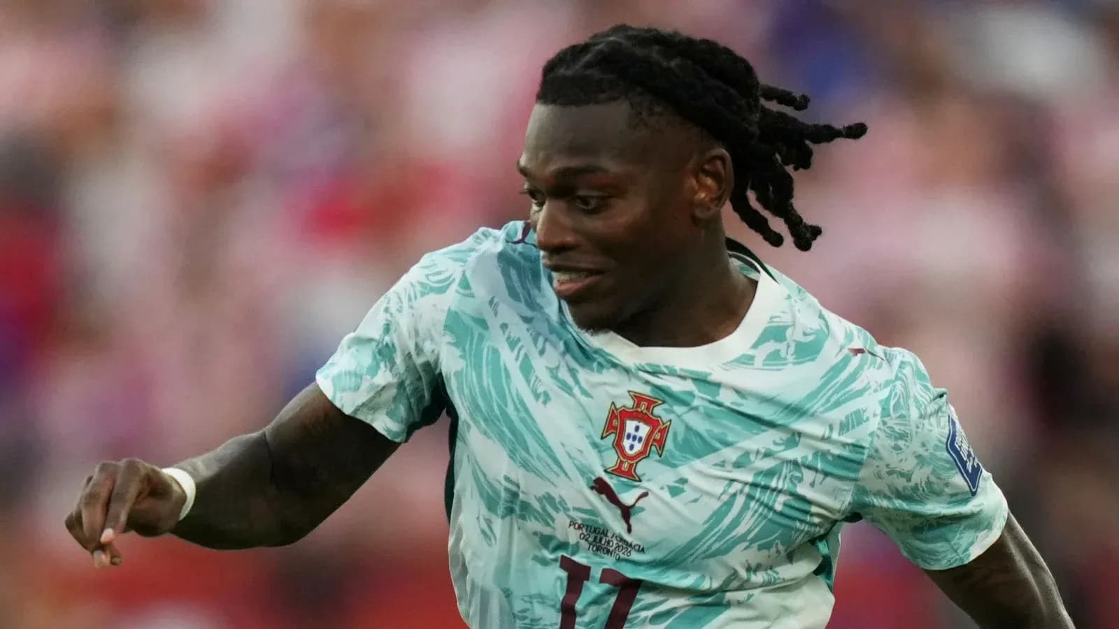 Player in Portugal kit running during a match Player in Portugal kit running during a match