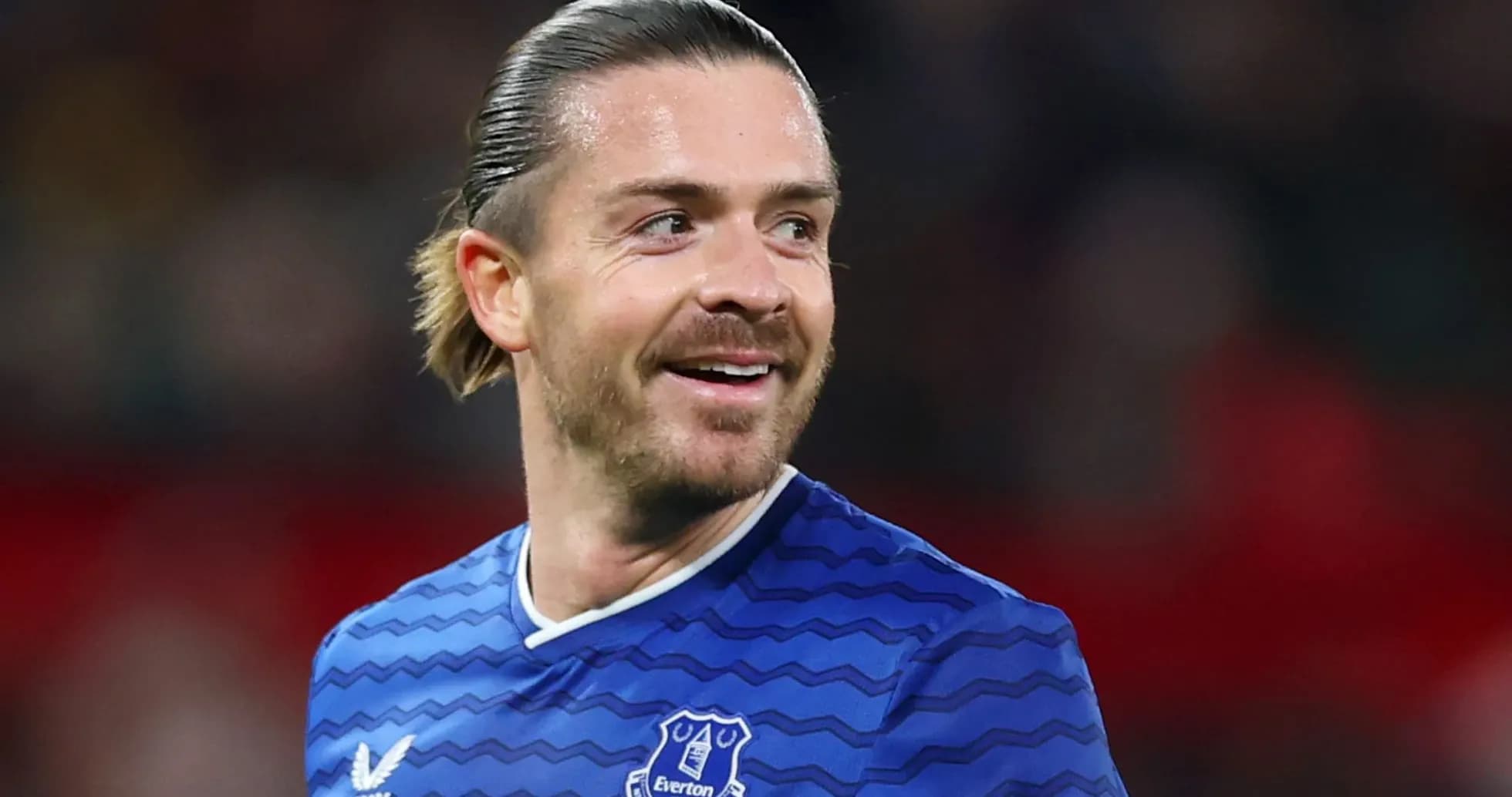 Player smiling in Everton jersey during match Player smiling in Everton jersey during match