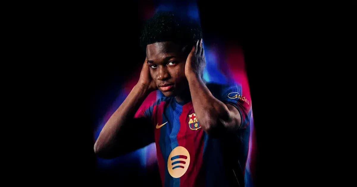 Player wearing Barcelona jersey posing with hands on ears Player wearing Barcelona jersey posing with hands on ears