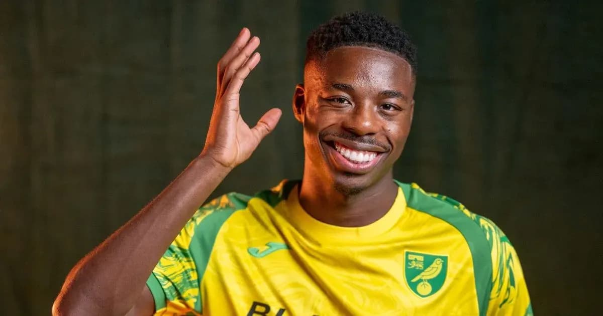 Player smiling and waving in team jersey Player smiling and waving in team jersey