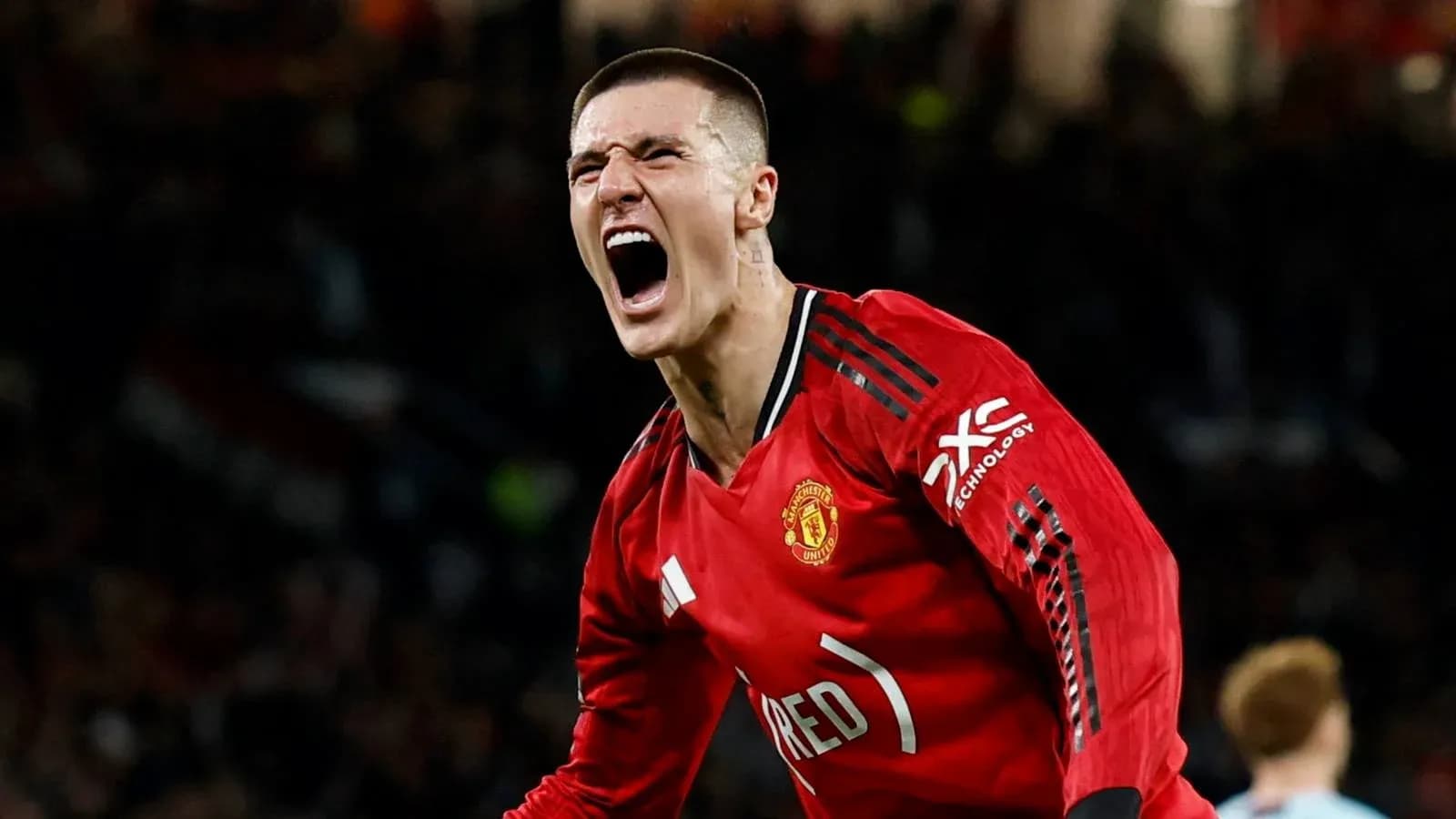 Player celebrating a goal in Manchester United jersey Player celebrating a goal in Manchester United jersey
