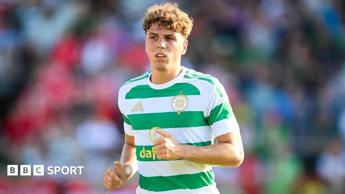Player in Celtic FC jersey running on the field Player in Celtic FC jersey running on the field