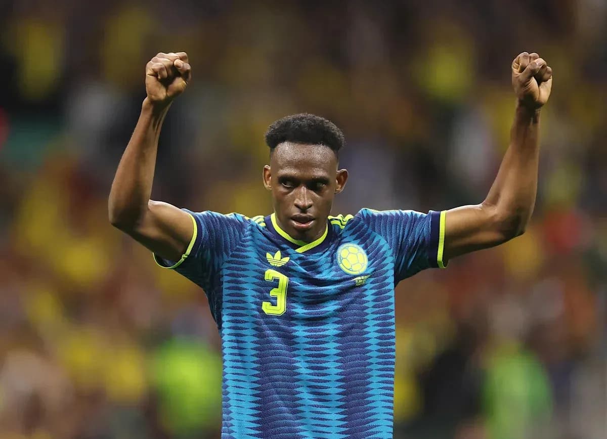 Player celebrating with raised fists on field Player celebrating with raised fists on field