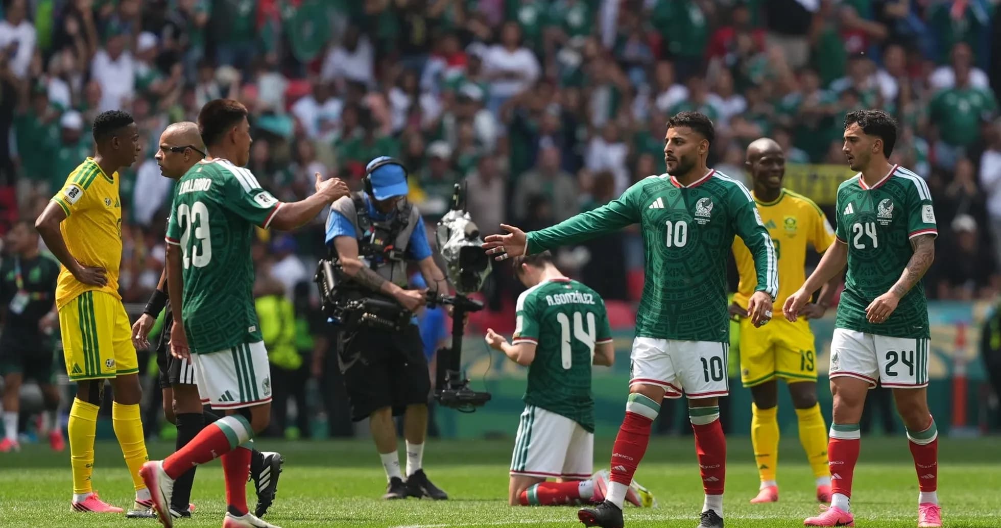 Mexico players celebrating during match against South Africa Mexico players celebrating during match against South Africa