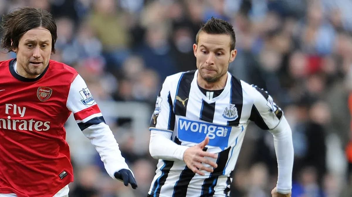 Two players running during a football match Two players running during a football match