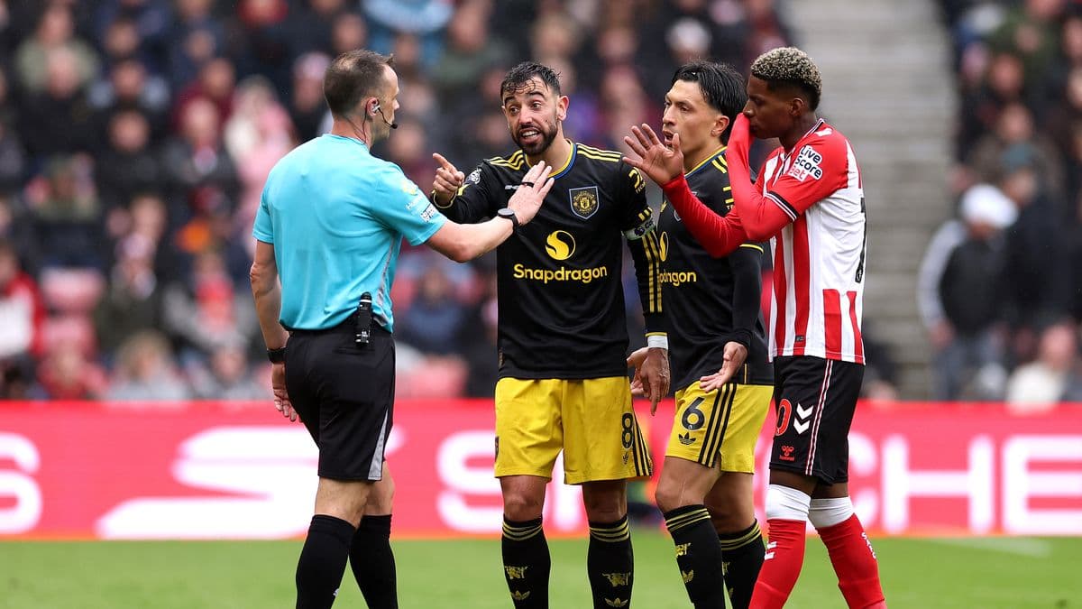 Players discussing with referee during a match Players discussing with referee during a match